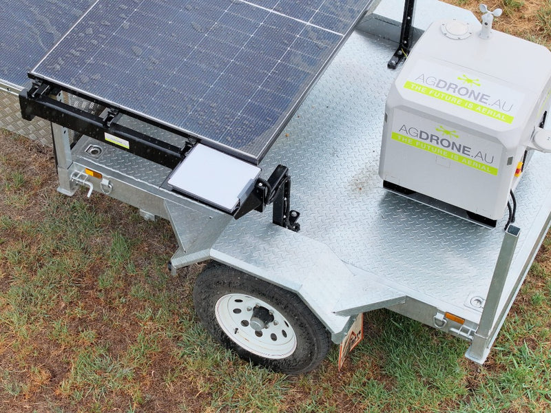 AgDock on the trailer, solar panel beside the nest.