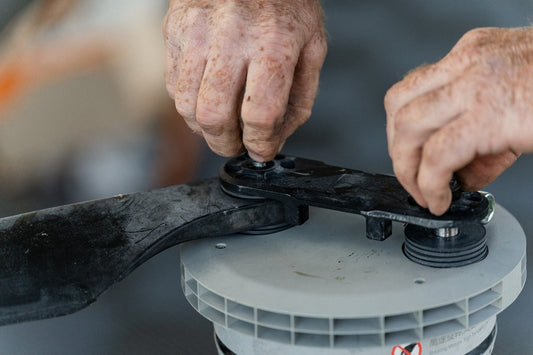 Hands fitting a propeller during an AgDrone Care service.